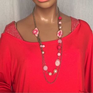 Pink long necklace double chain with pink flowers.
